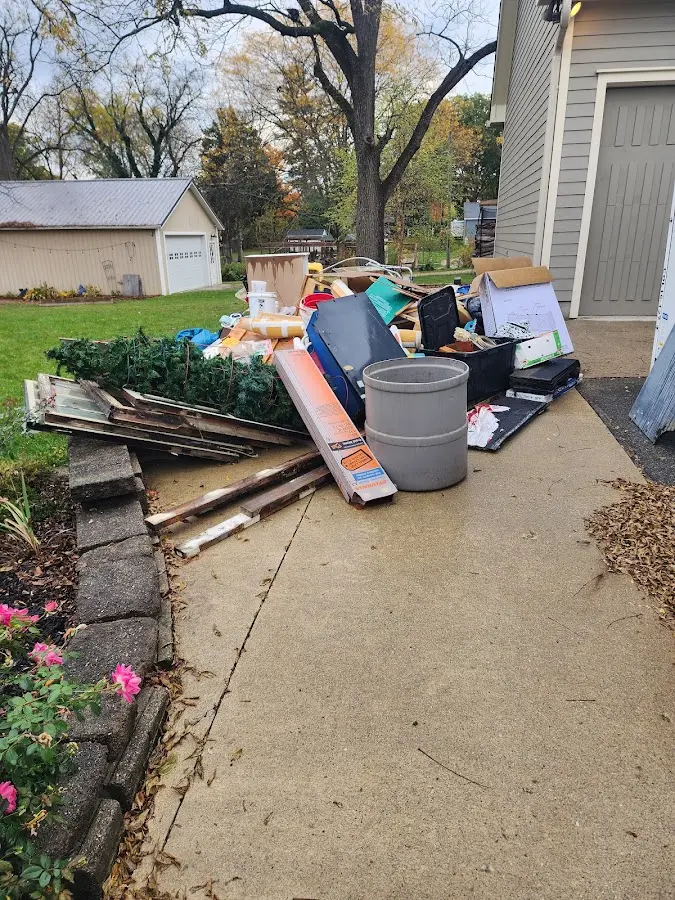Dumpster being loaded with debris for Demolition Dumpster Rental in Williams